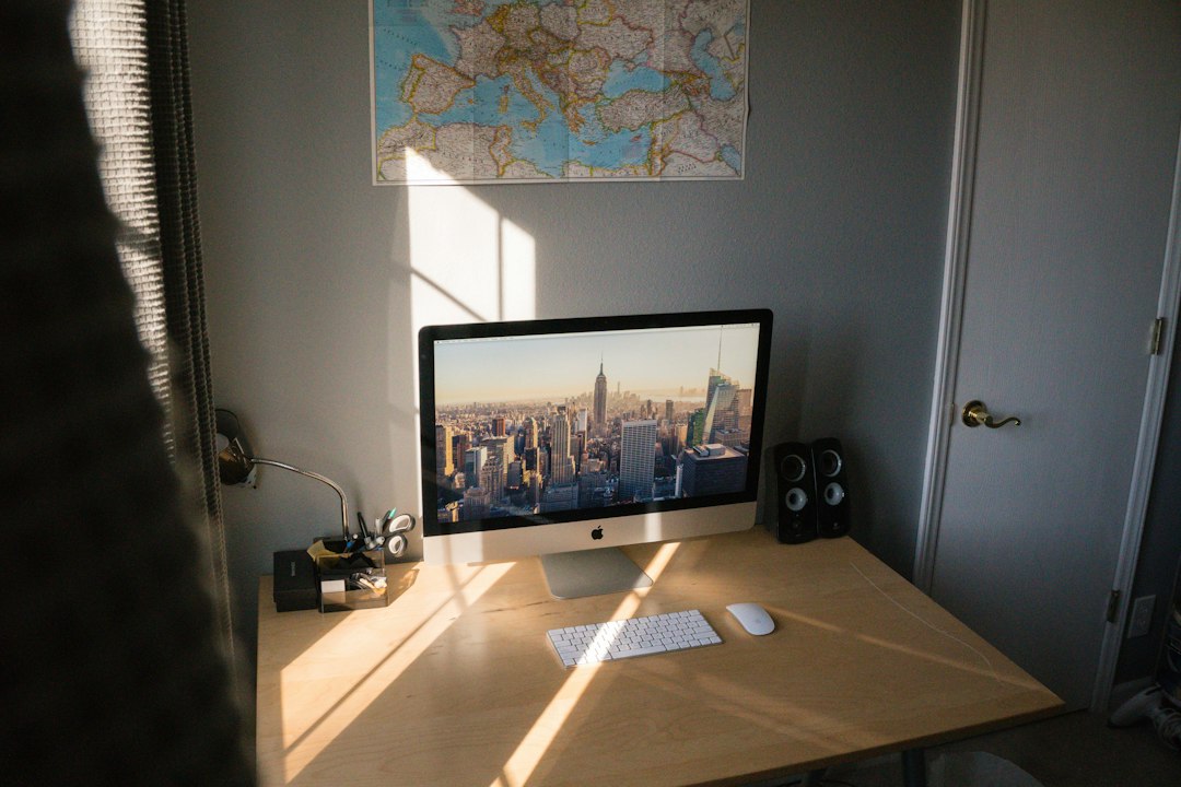 A magnifying glass held over a computer screen, focused on the details of an online real estate listing to symbolize careful vetting and spotting red flags.
